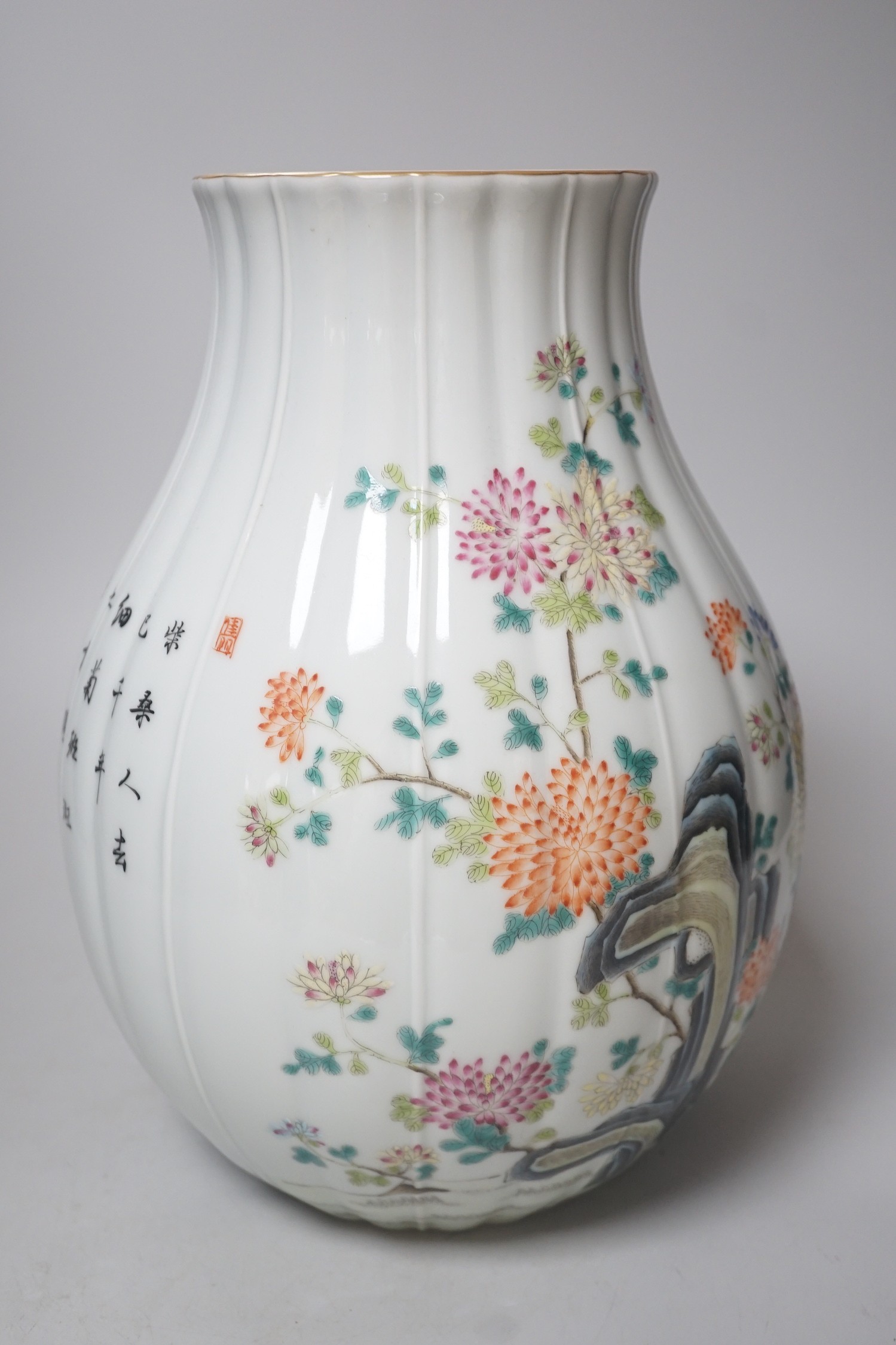 A Chinese famille rose lobed baluster vase, Qianlong seal mark but later. 30cm tall